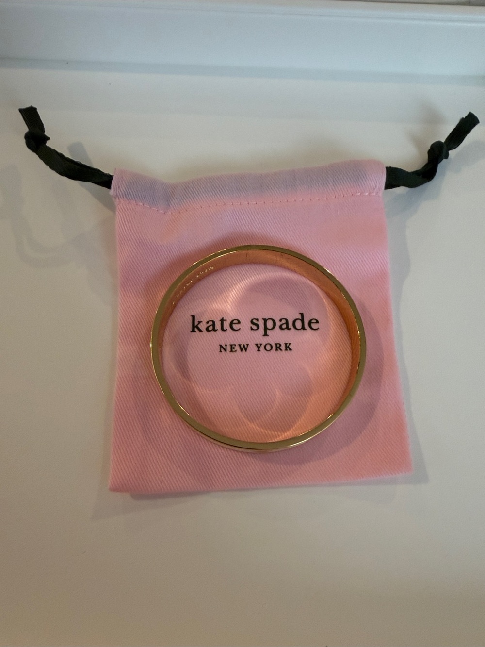 Kate spade cream and gold color bangle bracelet